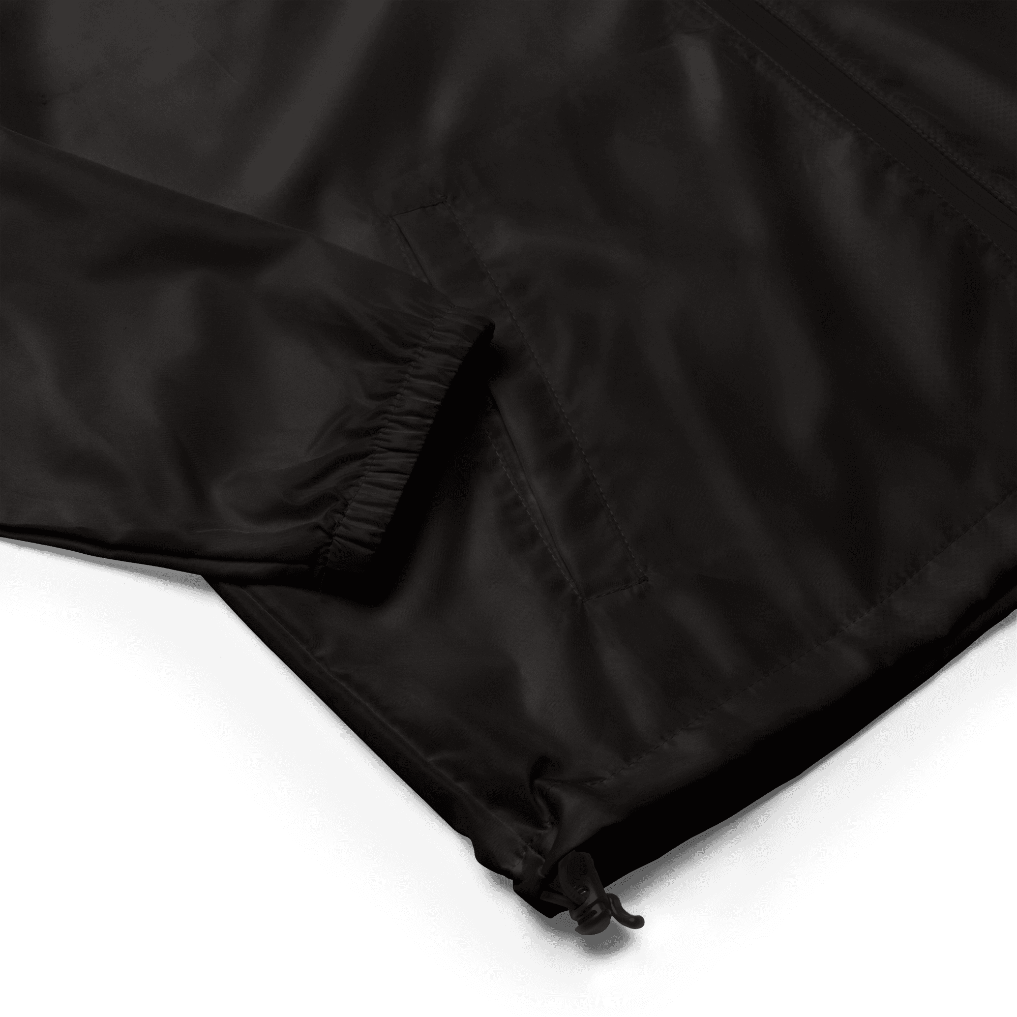 Welt pocket, elastic cuff and hem toggle detail on the black Lightweight Windbreaker