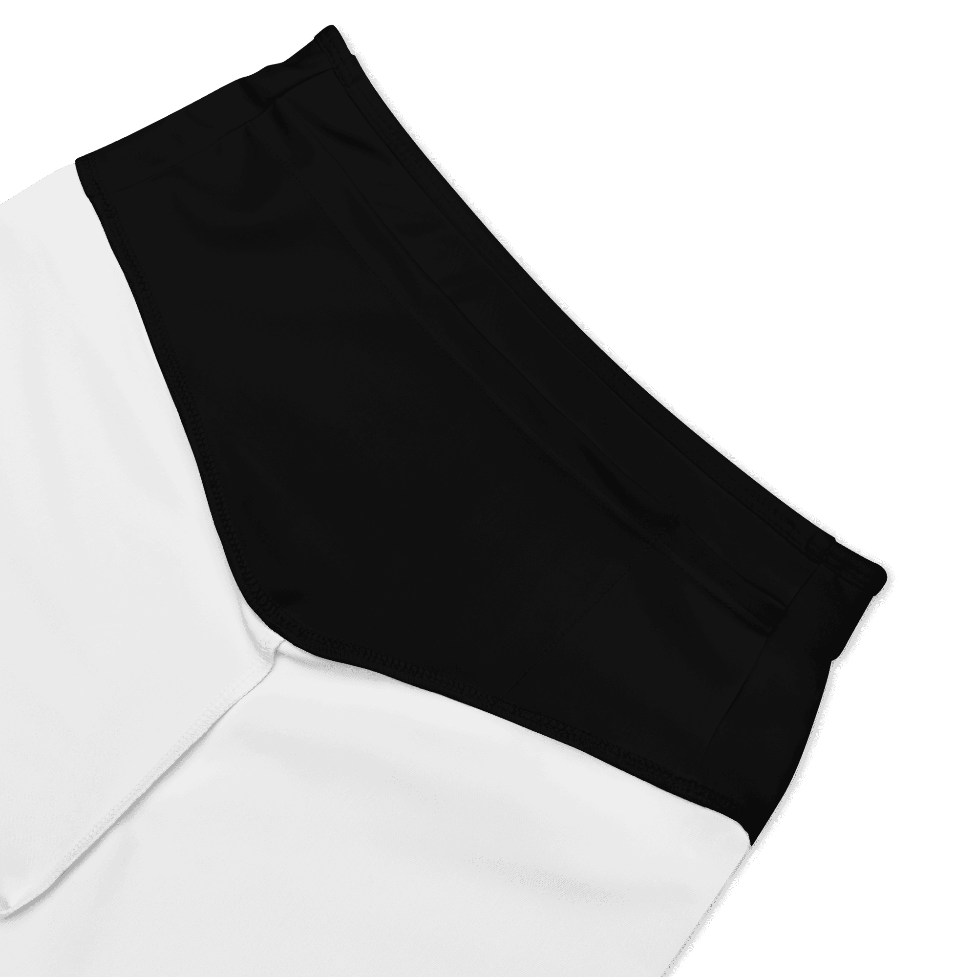 Inside waistband detail of the black biker shorts, showing a small inner pocket and white inner fabric.
