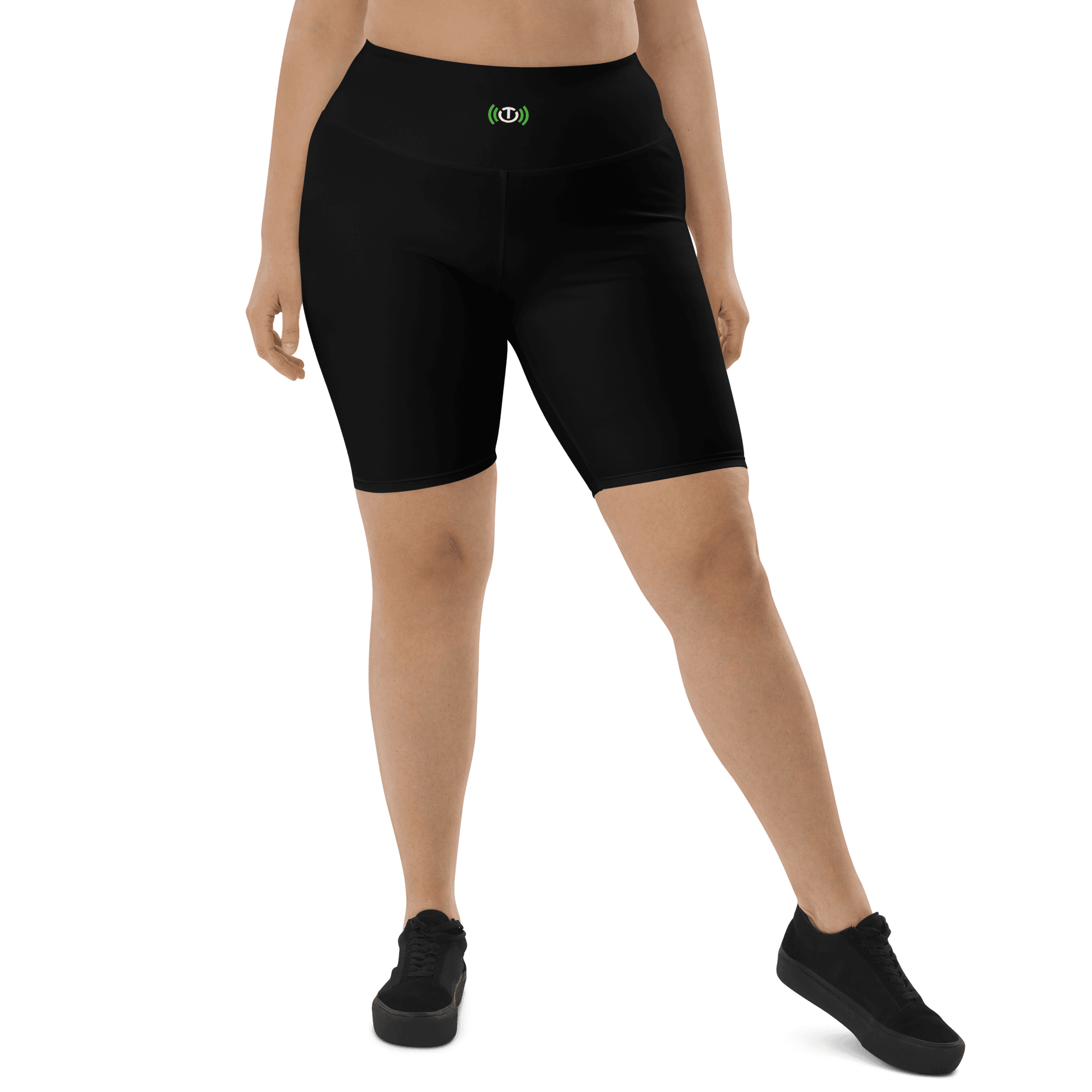 Front fit view of a model wearing black biker shorts with the TE icon at the center of the high waistband.